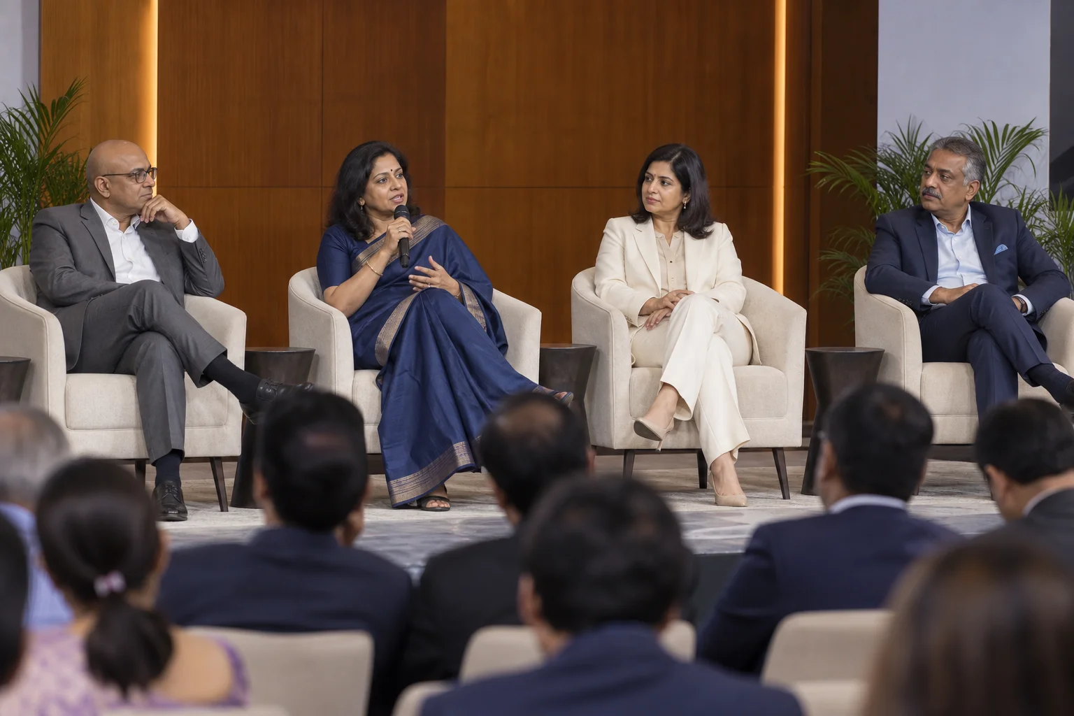 Four speakers taking part in a leadership panel